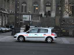 Cute little police car outside the ornate gates of Palais de Justice. © 2005 Lykara I. Charters