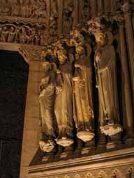 Saints line the entrance to Notre Dame de Paris. © 2005 Lykara I. Charters