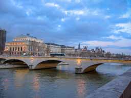 Pont Neuf (New Bridge) is actually the oldest bridge in Paris, the first one made of dressed stone and the first bridge built without shacks or houses on it. The relatively wide bridge, especially in medieval times, made it the perfect place for meetings, riots, duels, and other community activities. Note the large Ns on the side of the bridge. © 2005 Lykara I. Charters