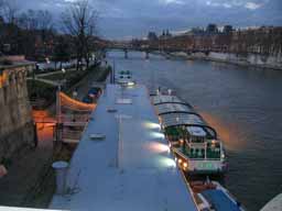 Seine river barge River barge on the River Seine. Tourists takes these barges on trips along the river, eating strange food and commenting on the fact that the French can't spell. © 2005 Lykara I. Charters