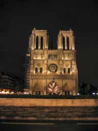 Notre Dame de Paris at night Notre Dame de Paris on Ile de la Cite in the center of Paris. Begun in 1163, it was essentially completed in 1267. For a slow handheld shot in bad lighting, this is scrumptious. © 2005 Lykara I. Charters