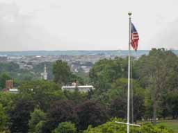 Looking south towards downtown DC. The Capitol Dome is just to the left of the flag. Photo © Lawrence I. Charters